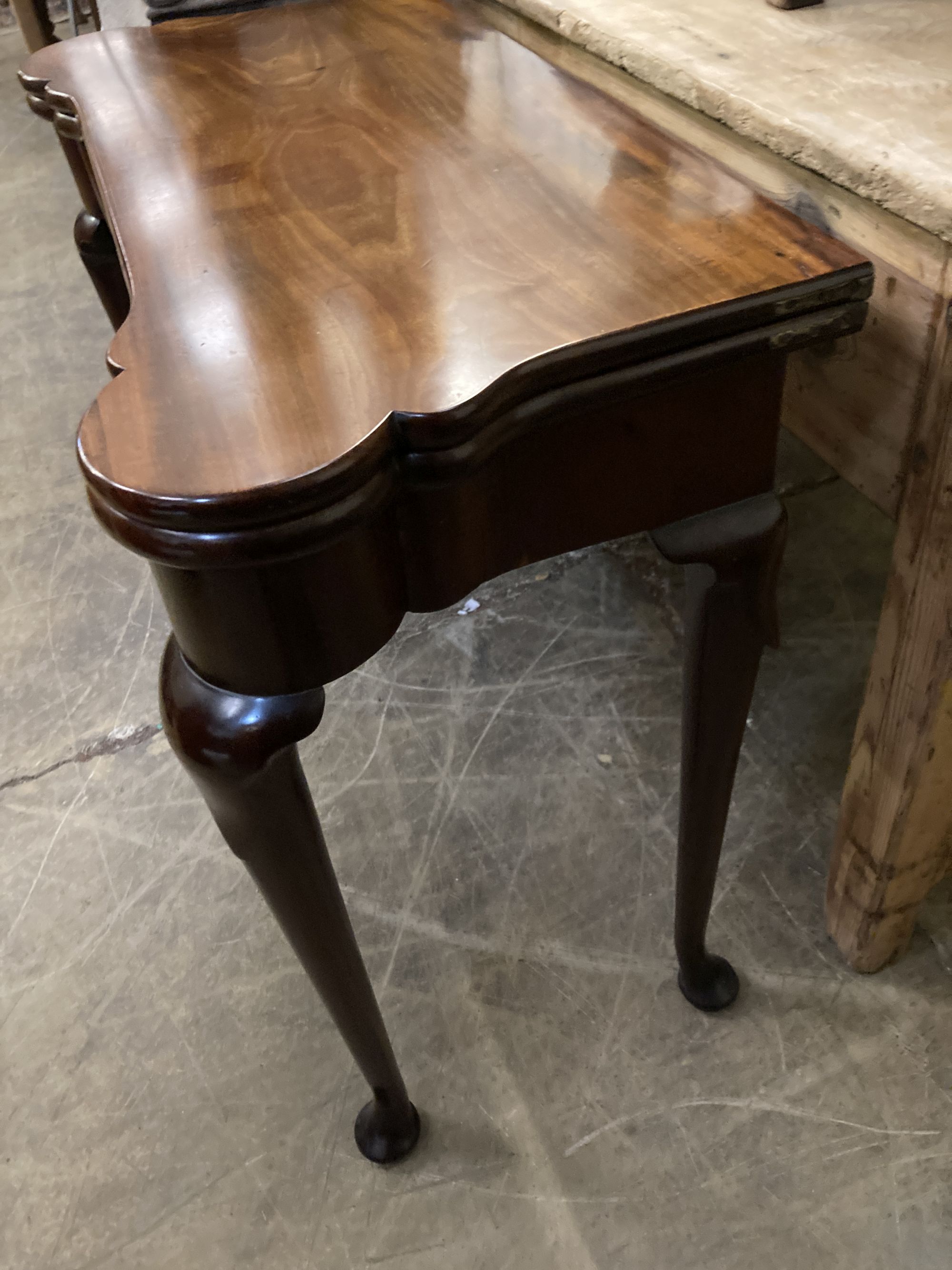 An 18th century mahogany folding card table, width 81cm, depth 38cm, height 71cm